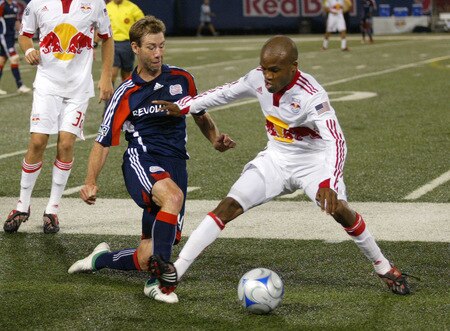 EAST RUTHERFORD, NJ - SEPTEMBER 18: Dane Richards #19 of the New York Red Bulls and Steve Ralston #14 of the New England Revolution battle for a loose ball during their game at Giants Stadium on September 18, 2009 in East Rutherford, New Jersey. The Red Bulls and Revolution played to a 1-1 tie.  <br /><br /><span class="help">(Photo by Andy Marlin/Getty Images for New York Red Bulls)</span>