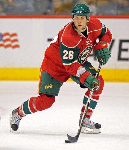 ST. PAUL, MN - SEPTEMBER 18: Jamie Sifers #26 of the Minnesota Wild brings the puck down ice during the first period in a preseason game on September 18, 2009 at the Xcel Energy Center in St. Paul, Minnesota. <br /><br /><span class="help">(Photo by Tom Dahlin/Getty Images)</span>
