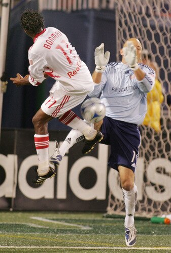 EAST RUTHERFORD, NJ - SEPTEMBER 18: Goalkeeper Matt Reis #31 of the New England Revolution makes a save while being screened by Danleigh Borman #11 of the New York Red Bulls during their game at Giants Stadium on September 18, 2009 in East Rutherford, New Jersey. The Red Bulls and the Revolution played to a 1-1 tie.  <br /><br /><span class="help">(Photo by Andy Marlin/Getty Images for New York Red Bulls)</span>