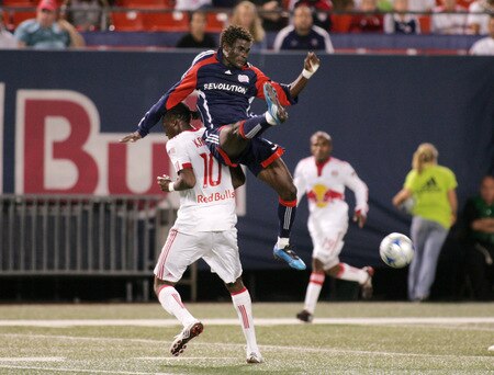EAST RUTHERFORD, NJ - SEPTEMBER 18: Emmanuel Osei #5 of the New England Revolution climbs the back of Macoumba Kandji #10 of the New York Red Bulls during their game at Giants Stadium on September 18, 2009 in East Rutherford, New Jersey. The Red Bulls and the Revolution played to a 1-1 tie. <br /><br /><span class="help">(Photo by Andy Marlin/Getty Images for New York Red Bulls)</span>