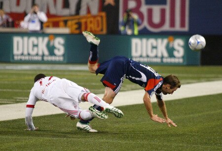 EAST RUTHERFORD, NJ - SEPTEMBER 18: Jeremy Hall #17 of the New York Red Bulls and Steve Ralston #14 of the New England Revolution collide going for a loose ball during their game at Giants Stadium on September 18, 2009 in East Rutherford, New Jersey. The Red Bulls and the Revolution played to a 1-1 tie. <br /><br /><span class="help">(Photo by Andy Marlin/Getty Images for New York Red Bulls)</span>
