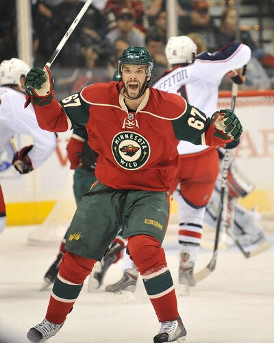 ST. PAUL, MN - SEPTEMBER 18: Benoit Pouliot #67 of the Minnesota Wild jubulates during the first period in a preseason game on September 18, 2009 at the Xcel Energy Center in St. Paul, Minnesota. <br /><br /><span class="help">(Photo by Tom Dahlin/Getty Images)</span>