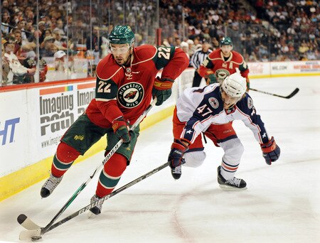 ST. PAUL, MN - SEPTEMBER 18: Cal Clutterbuck #22 of the Minnesota Wild chases the puck as Jonathan Sigalet #47of the Columbus Blue Jackets defends during the first period in a preseason game on September 18, 2009 at the Xcel Energy Center in St. Paul, Minnesota. <br /><br /><span class="help">(Photo by Tom Dahlin/Getty Images)</span>