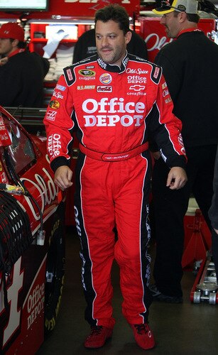 LOUDON, NH - SEPTEMBER 19:  Tony Stewart, driver of the #14 Office Depot/Old Spice Chevrolet, stands in the garage during practice for the NASCAR Sprint Cup Series Sylvania 300 at the New Hampshire Motor Speedway on September 19, 2009 in Loudon, New Hampshire  <br /><br /><span class="help">(Photo by Jim McIsaac/Getty Images for NASCAR)</span>