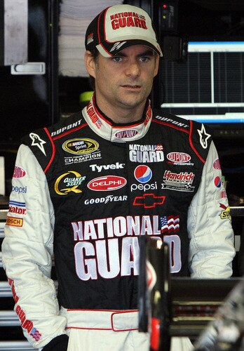 LOUDON, NH - SEPTEMBER 19:  Jeff Gordon, driver of the #24 DuPont/National Guard Yellow Ribbon Chevrolet,, stands in the garage during practice for the NASCAR Sprint Cup Series Sylvania 300 at the New Hampshire Motor Speedway on September 19, 2009 in Loudon, New Hampshire  <br /><br /><span class="help">(Photo by Jim McIsaac/Getty Images for NASCAR)</span>