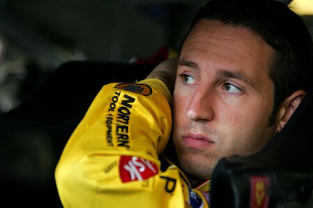 LOUDON, NH - SEPTEMBER 19:  Erik Darnell, driver of the #96 Northern Tool & Equipment Ford, climbs into his car during practice for the NASCAR Sprint Cup Series Sylvania 300 at the New Hampshire Motor Speedway on September 19, 2009 in Loudon, New Hampshire  <br /><br /><span class="help">(Photo by Todd Warshaw/Getty Images for NASCAR)</span>