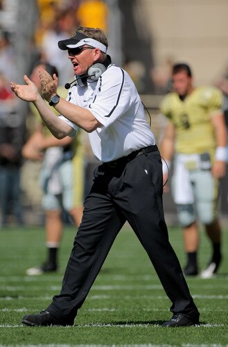 BOULDER, CO - SEPTEMBER 19:  Head coach Dan Hawkins of the Colorado Buffaloes leads his team against the Wyoming Cowboys at Folsom Field on September 19, 2009 in Boulder, Colorado.  <br /><br /><span class="help">(Photo by Doug Pensinger/Getty Images)</span>