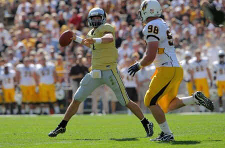 BOULDER, CO - SEPTEMBER 19:  Quarterback Cody Hawkins #7 of the Colorado Buffaloes delivers a pass over Mitch Unrein #98 of the Wyoming Cowboys at Folsom Field on September 19, 2009 in Boulder, Colorado.  <br /><br /><span class="help">(Photo by Doug Pensinger/Getty Images)</span>