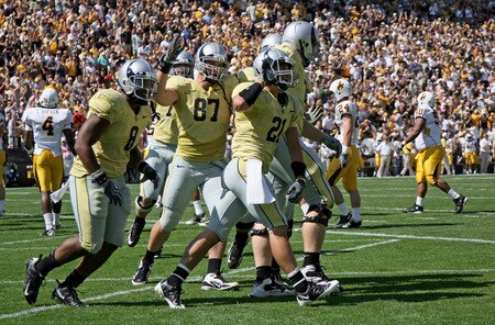 BOULDER, CO - SEPTEMBER 19:  Wide reciever Scotty McKnight #21 of the Colorado Buffaloes celebrates his first quarter touchdown with his teammates against the Wyoming Cowboys at Folsom Field on September 19, 2009 in Boulder, Colorado.  <br /><br /><span class="help">(Photo by Doug Pensinger/Getty Images)</span>