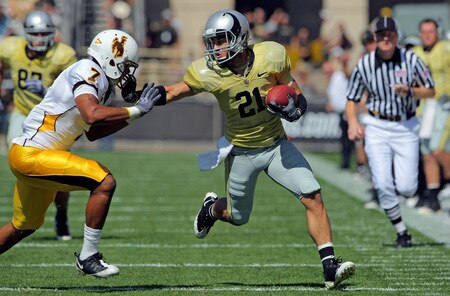BOULDER, CO - SEPTEMBER 19:  Wide reciever Scotty McKnight #21 of the Colorado Buffaloes makes a reception for a first down before being forced out of bounds by Shamiel Gary #7 of the Wyoming Cowboys at Folsom Field on September 19, 2009 in Boulder, Colorado.  <br /><br /><span class="help">(Photo by Doug Pensinger/Getty Images)</span>