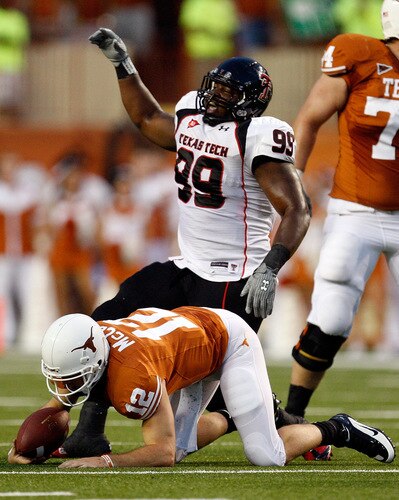 AUSTIN, TX - SEPTEMBER 19:  Tackle Richard Jones #99 of the Texas Tech Red Raiders celebrates a sack against Colt McCoy #12 of the Texas Longhorns at Darrell K Royal-Texas Memorial Stadium on September 19, 2009 in Austin, Texas.  <br /><br /><span class="help">(Photo by Ronald Martinez/Getty Images)</span>