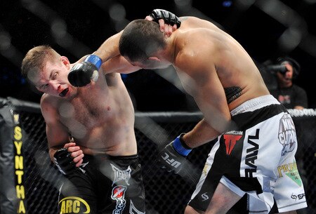 DALLAS - SEPTEMBER 19:  UFC fighter Nik Lentz (L) battles UFC fighter Rafaello Oliveira (R) during their Lightweight bout at UFC 103: Franklin vs. Belfort at the American Airlines Center on September 19, 2009 in Dallas, Texas.  <br /><br /><span class="help">(Photo by Jon Kopaloff/Getty Images)</span>