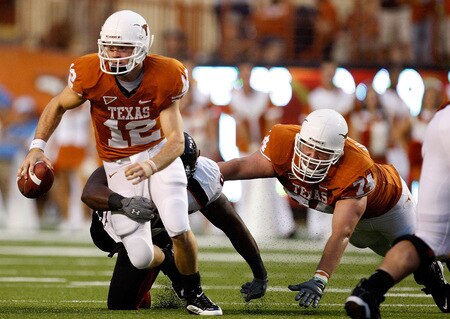 AUSTIN, TX - SEPTEMBER 19:  Quarterback Colt McCoy #12 of the Texas Longhorns is sacked by Richard Jones #99 of the Texas Tech Red Raiders at Darrell K Royal-Texas Memorial Stadium on September 19, 2009 in Austin, Texas.  <br /><br /><span class="help">(Photo by Ronald Martinez/Getty Images)</span>