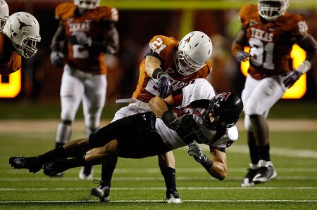 AUSTIN, TX - SEPTEMBER 19:  Wide receiver Alexander Torres #86 of the Texas Tech Red Raiders makes a pass reception against Blake Gideon #21 of the Texas Longhorns at Darrell K Royal-Texas Memorial Stadium on September 19, 2009 in Austin, Texas.  <br /><br /><span class="help">(Photo by Ronald Martinez/Getty Images)</span>