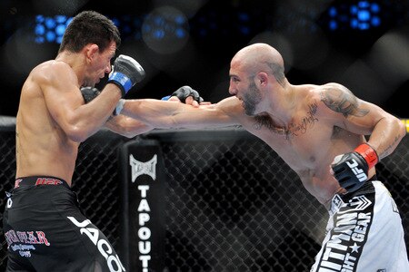 DALLAS - SEPTEMBER 19:  UFC fighter Rafael Dos Anjos (L) battles UFC fighter Rob Emerson (R) during their Lightweight bout at UFC 103: Franklin vs. Belfort at the American Airlines Center on September 19, 2009 in Dallas, Texas.  <br /><br /><span class="help">(Photo by Jon Kopaloff/Getty Images)</span>