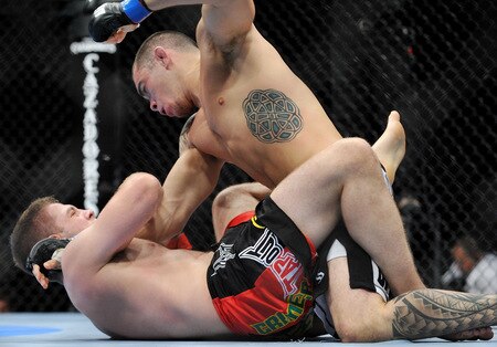 DALLAS - SEPTEMBER 19:  UFC fighter Nik Lentz (L) battles UFC fighter Rafaello Oliveira (R) during their Lightweight bout at UFC 103: Franklin vs. Belfort at the American Airlines Center on September 19, 2009 in Dallas, Texas.  <br /><br /><span class="help">(Photo by Jon Kopaloff/Getty Images)</span>