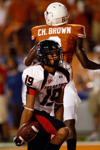 AUSTIN, TX - SEPTEMBER 19:  Wide receiver Lyle Leong #19 of the Texas Tech Red Raiders makes a touchdown pass reception against Chykie Brown #8 of the Texas Longhorns at Darrell K Royal-Texas Memorial Stadium on September 19, 2009 in Austin, Texas.  <br /><br /><span class="help">(Photo by Ronald Martinez/Getty Images)</span>