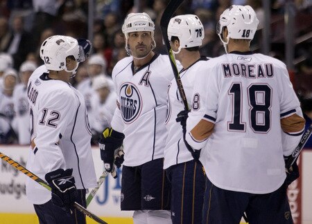 VANCOUVER, CANADA - SEPTEMBER 19: Sheldon Souray #44 of the Edmonton Oilers celebrates with teammates Robert Nilsson #12, Marc-Antoine Pouliot #78 and Ethan Moreau #18 after scoring against the Vancouver Canucks during the first period of NHL preseason action on September 19, 2009 at General Motors Place in Vancouver, British Columbia, Canada.  <br /><br /><span class="help">(Photo by Rich Lam/Getty Images)</span>