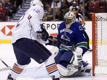 VANCOUVER, CANADA - SEPTEMBER 19: Goalie Roberto Luongo #1 of the Vancouver Canucks stops Robert Nilsson #12 of the Edmonton Oilers in close during the first period of NHL preseason action on September 19, 2009 at General Motors Place in Vancouver, British Columbia, Canada.  <br /><br /><span class="help">(Photo by Rich Lam/Getty Images)</span>