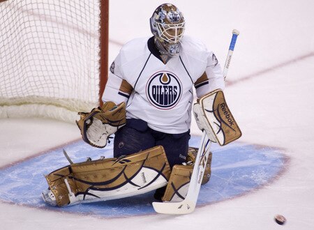 VANCOUVER, CANADA - SEPTEMBER 19:  Goaltender Jeff Deslauriers #38 of the Edmonton Oilers makes a save during the warm up prior to playing the Vancouver Canucks in NHL preseason action on September 19, 2009 at General Motors Place in Vancouver, British Columbia, Canada.  <br /><br /><span class="help">(Photo by Rich Lam/Getty Images)</span>