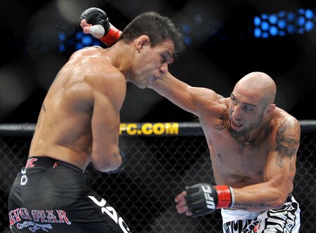 DALLAS - SEPTEMBER 19:  UFC fighter Rafael Dos Anjos (L) battles UFC fighter Rob Emerson (R) during their Lightweight bout at UFC 103: Franklin vs. Belfort at the American Airlines Center on September 19, 2009 in Dallas, Texas.  <br /><br /><span class="help">(Photo by Jon Kopaloff/Getty Images)</span>