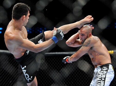 DALLAS - SEPTEMBER 19:  UFC fighter Rafael Dos Anjos (L) battles UFC fighter Rob Emerson (R) during their Lightweight bout at UFC 103: Franklin vs. Belfort at the American Airlines Center on September 19, 2009 in Dallas, Texas.  <br /><br /><span class="help">(Photo by Jon Kopaloff/Getty Images)</span>