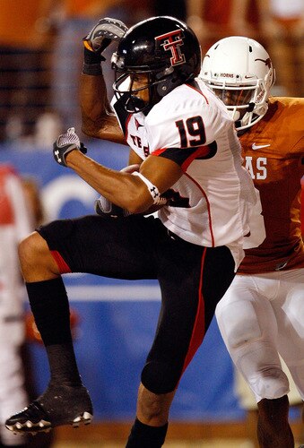 AUSTIN, TX - SEPTEMBER 19:  Wide receiver Lyle Leong #19 of the Texas Tech Red Raiders makes a touchdown pass reception against Chykie Brown #8 of the Texas Longhorns at Darrell K Royal-Texas Memorial Stadium on September 19, 2009 in Austin, Texas.  <br /><br /><span class="help">(Photo by Ronald Martinez/Getty Images)</span>