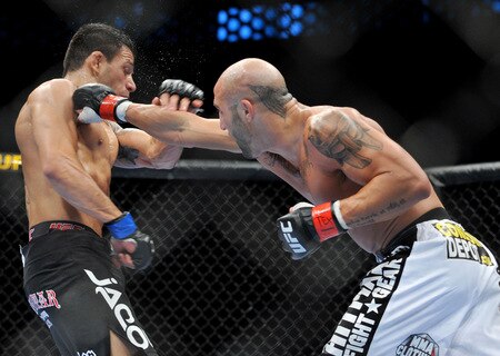 DALLAS - SEPTEMBER 19:  UFC fighter Rafael Dos Anjos (L) battles UFC fighter Rob Emerson (R) during their Lightweight bout at UFC 103: Franklin vs. Belfort at the American Airlines Center on September 19, 2009 in Dallas, Texas.  <br /><br /><span class="help">(Photo by Jon Kopaloff/Getty Images)</span>