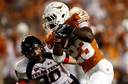 AUSTIN, TX - SEPTEMBER 19:  Running back Tre' Newton #23 of the Texas Longhorns runs for a touchdown against Brett Dewhurst #30 of the Texas Tech Red Raiders at Darrell K Royal-Texas Memorial Stadium on September 19, 2009 in Austin, Texas.  <br /><br /><span class="help">(Photo by Ronald Martinez/Getty Images)</span>