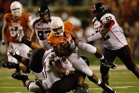 AUSTIN, TX - SEPTEMBER 19:  Wide receiver John Chiles #7 of the Texas Longhorns runs the ball past Victor Hunter #52 of the Texas Tech Red Raiders at Darrell K Royal-Texas Memorial Stadium on September 19, 2009 in Austin, Texas.  <br /><br /><span class="help">(Photo by Ronald Martinez/Getty Images)</span>