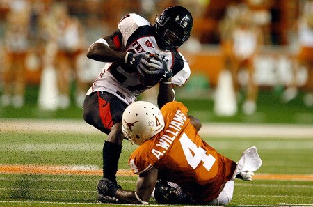 AUSTIN, TX - SEPTEMBER 19:  Wide receiver Edward Britton #27 of the Texas Tech Red Raiders makes a pass reception against Aaron Williams #4 of the Texas Longhorns at Darrell K Royal-Texas Memorial Stadium on September 19, 2009 in Austin, Texas.  <br /><br /><span class="help">(Photo by Ronald Martinez/Getty Images)</span>