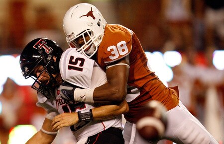 AUSTIN, TX - SEPTEMBER 19:  Quarterback Taylor Potts #15 of the Texas Tech Red Raiders is sacked by Roddrick Muckelroy #38 of the Texas Longhorns at Darrell K Royal-Texas Memorial Stadium on September 19, 2009 in Austin, Texas.  <br /><br /><span class="help">(Photo by Ronald Martinez/Getty Images)</span>