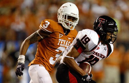 AUSTIN, TX - SEPTEMBER 19:  Wide receiver Lyle Leong #19 of the Texas Tech Red Raiders runs the ball past Curtis Brown #3 of the Texas Longhorns at Darrell K Royal-Texas Memorial Stadium on September 19, 2009 in Austin, Texas.  <br /><br /><span class="help">(Photo by Ronald Martinez/Getty Images)</span>