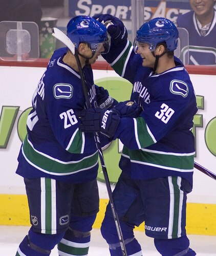 VANCOUVER, CANADA - SEPTEMBER 19: Cody Hodgson #39 of the Vancouver Canucks is congratulated by teammate Mikael Samuelsson #26 after scoring against the Edmonton Oilers during the third period of NHL preseason action on September 19, 2009 at General Motors Place in Vancouver, British Columbia, Canada.  <br /><br /><span class="help">(Photo by Rich Lam/Getty Images)</span>