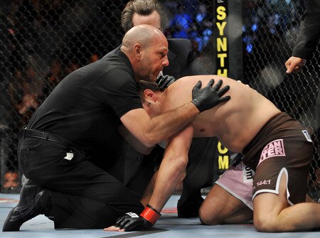 DALLAS - SEPTEMBER 19:  UFC fighter Rich Franklin (R) gets knocked out by UFC fighter Vitor Belfort with referee Yves Lavigne (L) protecting him during their Catch weight bout at UFC 103: Franklin vs. Belfort at the American Airlines Center on September 19, 2009 in Dallas, Texas.  <br /><br /><span class="help">(Photo by Jon Kopaloff/Getty Images)</span>