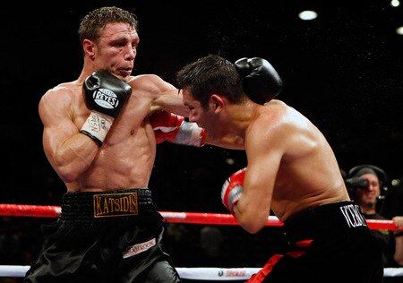 LAS VEGAS - SEPTEMBER 19:  Michael Katsidis (L) throws a punch at Vincent Escobedo in the fifth round of their WBO interim lightweight title fight at the MGM Grand Garden Arena September 19, 2009 in Las Vegas, Nevada. Katsidis won the title by split decision.  <br /><br /><span class="help">(Photo by Ethan Miller/Getty Images)</span>