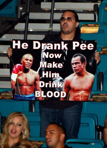 LAS VEGAS - SEPTEMBER 19:  A fan holds a sign during an undercard of the Floyd Mayweather Jr. and Juan Manuel Marquez fight at the MGM Grand Garden Arena September 19, 2009 in Las Vegas, Nevada.  <br /><br /><span class="help">(Photo by Ethan Miller/Getty Images)</span>