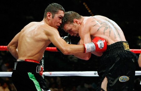 LAS VEGAS - SEPTEMBER 19:  Vincent Escobedo (L) hits Michael Katsidis in the sixth round of their WBO interim lightweight title fight at the MGM Grand Garden Arena September 19, 2009 in Las Vegas, Nevada. Katsidis won the title by split decision.  <br /><br /><span class="help">(Photo by Ethan Miller/Getty Images)</span>