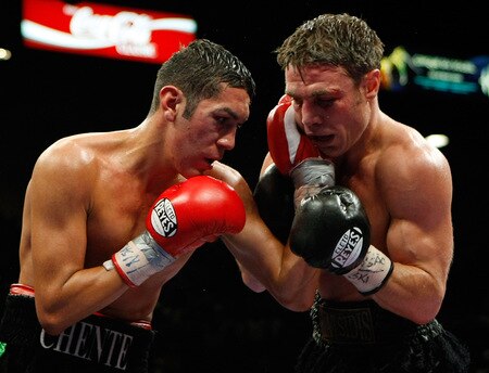 LAS VEGAS - SEPTEMBER 19:  Vincent Escobedo (L) hits Michael Katsidis in the 11th round of their WBO interim lightweight title fight at the MGM Grand Garden Arena September 19, 2009 in Las Vegas, Nevada. Katsidis won the title by split decision.  <br /><br /><span class="help">(Photo by Ethan Miller/Getty Images)</span>