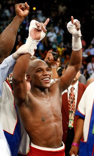 LAS VEGAS - SEPTEMBER 19:  Floyd Mayweather Jr. celebrates his unanimous-decision victory over Juan Manuel Marquez at the MGM Grand Garden Arena September 19, 2009 in Las Vegas, Nevada.  <br /><br /><span class="help">(Photo by Ethan Miller/Getty Images)</span>