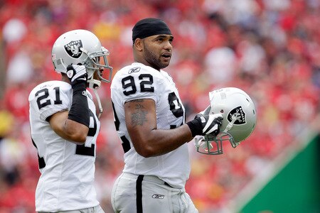 KANSAS CITY, MO - SEPTEMBER 20:  Defensive end Richard Seymour #92 of the Oakland Raiders walks onto the field with Nnamdi Asomugha #21 during the game against the Kansas City Chiefs at Arrowhead Stadium on September 20, 2009 in Kansas City, Missouri.  <br /><br /><span class="help">(Photo by Jamie Squire/Getty Images)</span>