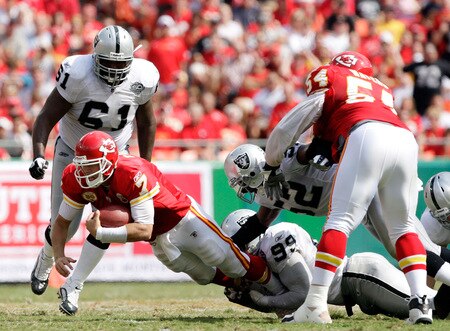 KANSAS CITY, MO - SEPTEMBER 20:  Quarterback Matt Cassel #7 of the Kansas City Chiefs is sacked by Kirk Morrison #52 and Greg Ellis #99 of the Oakland Raiders during the game at Arrowhead Stadium on September 20, 2009 in Kansas City, Missouri.  <br /><br /><span class="help">(Photo by Jamie Squire/Getty Images)</span>