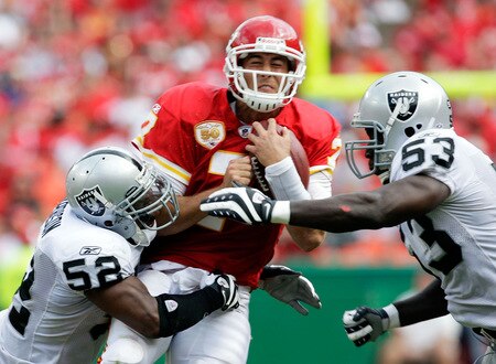 KANSAS CITY, MO - SEPTEMBER 20:  Quarterback Matt Cassel #7 of the Kansas City Chiefs is hit by linebackers Kirk Morrison #52 and Thomas Howard #53 of the Oakland Raiders during the game at Arrowhead Stadium on September 20, 2009 in Kansas City, Missouri.  <br /><br /><span class="help">(Photo by Jamie Squire/Getty Images)</span>