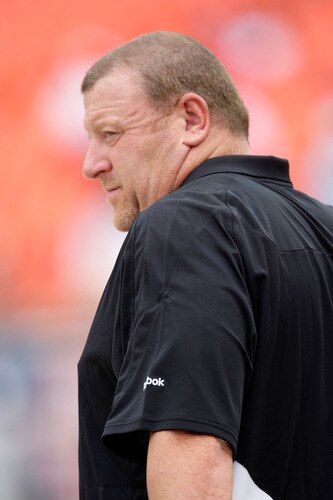 KANSAS CITY, MO - SEPTEMBER 20:  Head coach Tom Cable of the Oakland Raiders watches from the bench during warm-ups prior to the start of the game against the Kansas City Chiefs at Arrowhead Stadium on September 20, 2009 in Kansas City, Missouri.  <br /><br /><span class="help">(Photo by Jamie Squire/Getty Images)</span>