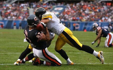 CHICAGO - SEPTEMBER 20: Kellen Davis #87 of the Chicago Bears holds on to the ball for a touchdown as he's hit by Tyrone Carter #23 and James Farrior #51 of the Pittsburgh Steelers at Soldier Field on September 20, 2009 in Chicago, Illinois. <br /><br /><span class="help">(Photo by Jonathan Daniel/Getty Images)</span>