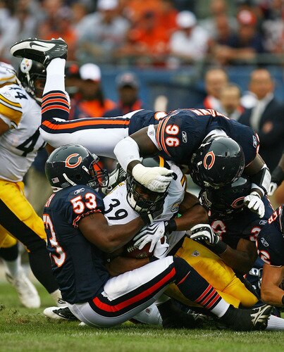 CHICAGO - SEPTEMBER 20: (L-R) Nick Roach #53, Alex Brown #96 and Danieal Manning #38 of the Chicago Bears gang tackle Willie Parker #39 of the Pittsburgh Steelers at Soldier Field on September 20, 2009 in Chicago, Illinois. <br /><br /><span class="help">(Photo by Jonathan Daniel/Getty Images)</span>