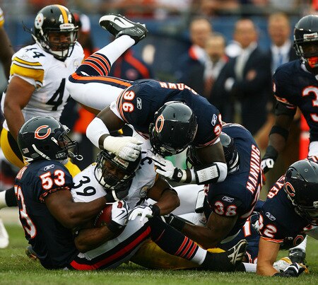 CHICAGO - SEPTEMBER 20: (L-R) Nick Roach #53, Alex Brown #96 and Danieal Manning #38 of the Chicago Bears gang tackle Willie Parker #39 of the Pittsburgh Steelers at Soldier Field on September 20, 2009 in Chicago, Illinois. <br /><br /><span class="help">(Photo by Jonathan Daniel/Getty Images)</span>