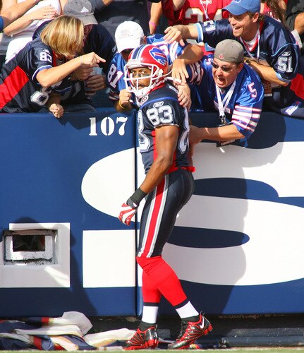 ORCHARD PARK, NY - SEPTEMBER 20: Lee Evans #83  of the Buffalo Bills celebrates with fans after scoring on a 32 yard pass reception against the Tampa Bay Buccaneers at Ralph Wilson Stadium on September 20, 2009 in Orchard Park, New York. Buffalo won 33-20. <br /><br /><span class="help">(Photo by Rick Stewart/Getty Images)</span>