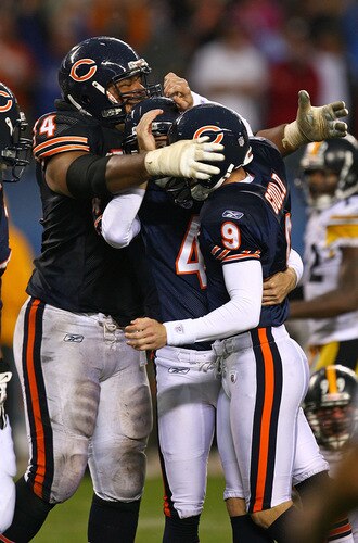 CHICAGO - SEPTEMBER 20: Chris Williams # 74 of the Chicago Bears grabs teammates Brad Maynard #4 and Robbie Gould #9 after Gould kicked the game-winning field goal against the Pittsburgh Steelers on September 20, 2009 at Soldier Field in Chicago, Illinois. The Bears defeated the Steelers 17-14. <br /><br /><span class="help">(Photo by Jonathan Daniel/Getty Images)</span>