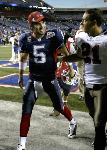 ORCHARD PARK, NY - SEPTEMBER 20: Trent Edwards #5 of the Buffalo Bills walks off the field with Sabby Piscitelli #21 of the Tampa Bay Buccaneers at Ralph Wilson Stadium on September 20, 2009 in Orchard Park, New York. Buffalo won 33-20. <br /><br /><span class="help">(Photo by Rick Stewart/Getty Images)</span>